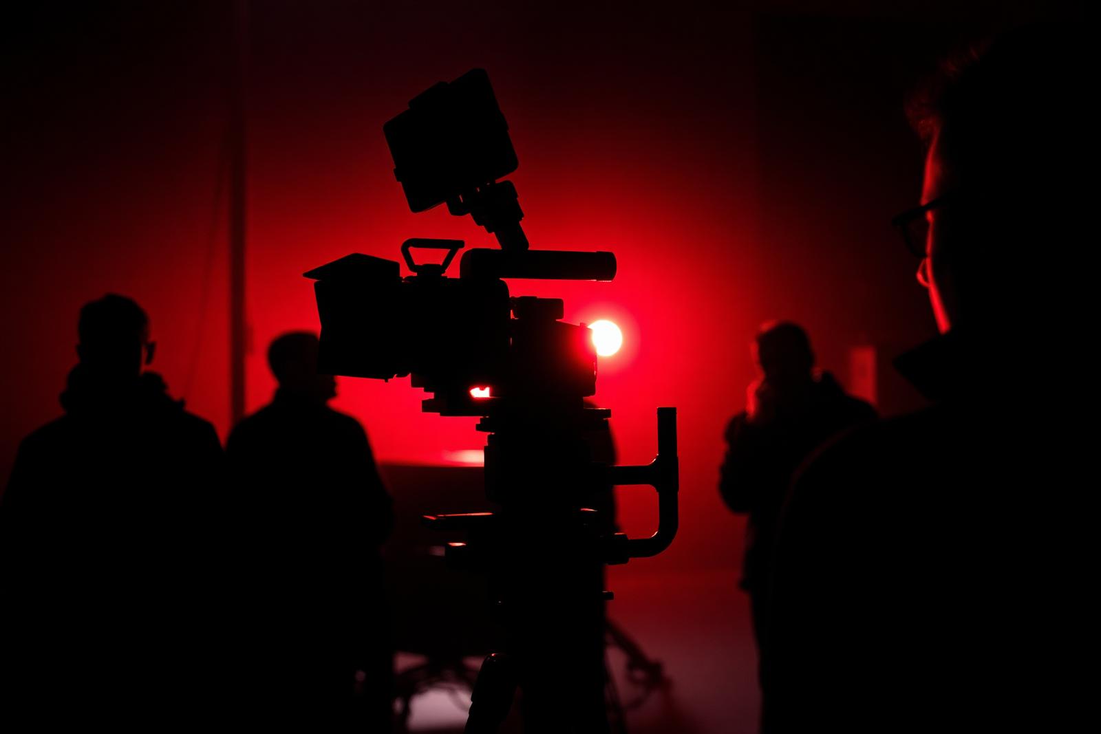Cinematic production light against deep red haze