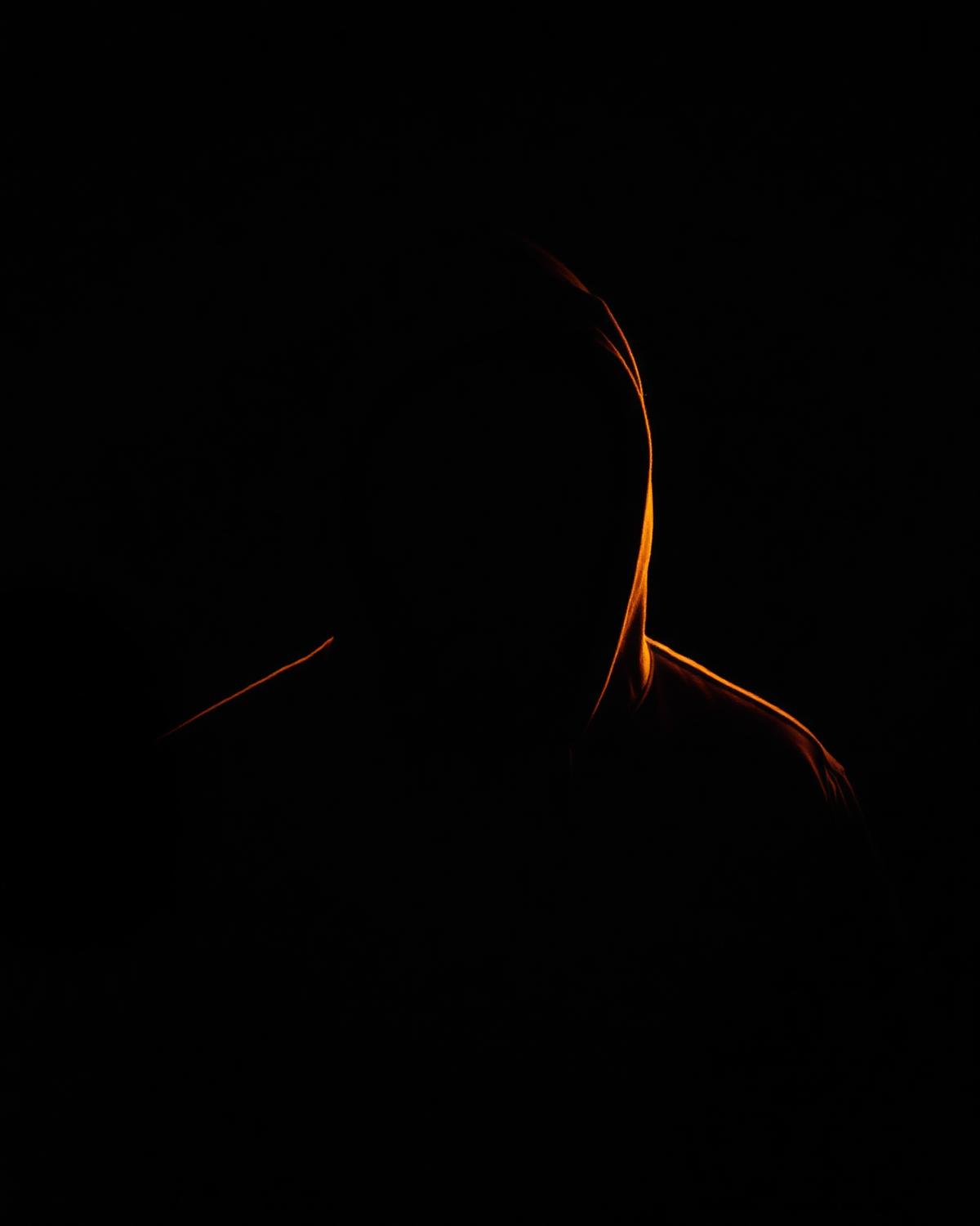 Rim-lit editorial portrait silhouette